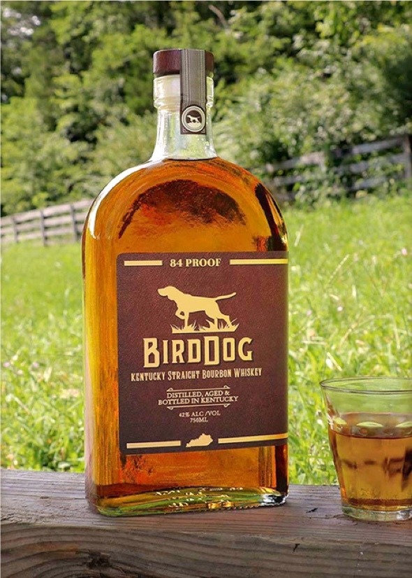 Bottle of Bird Dog Kentucky Straight Bourbon Whiskey with a Cocktail