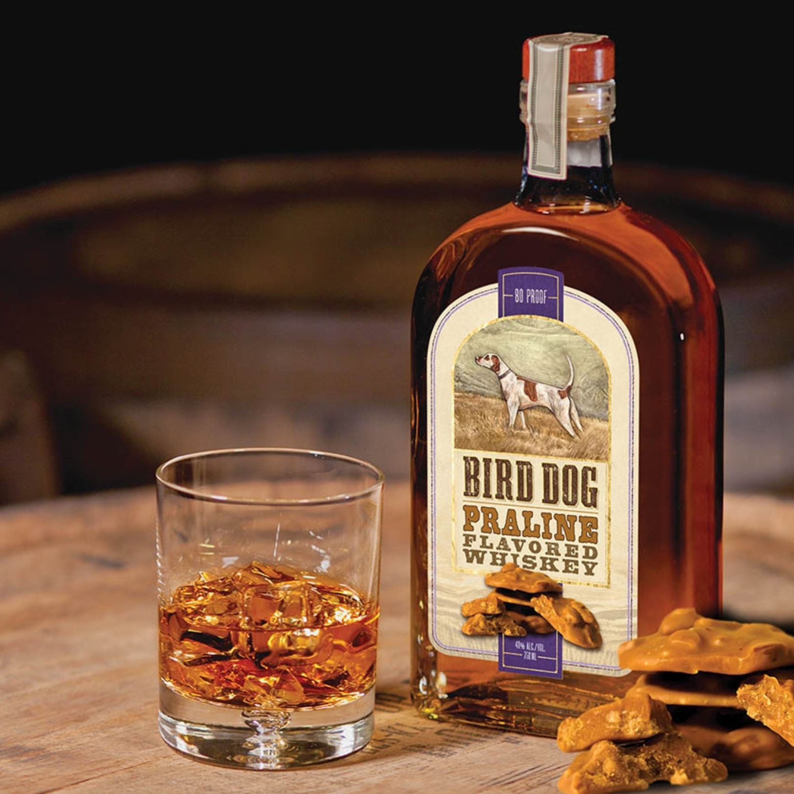 Bottle of Bird Dog Praline Whiskey with a Cocktail