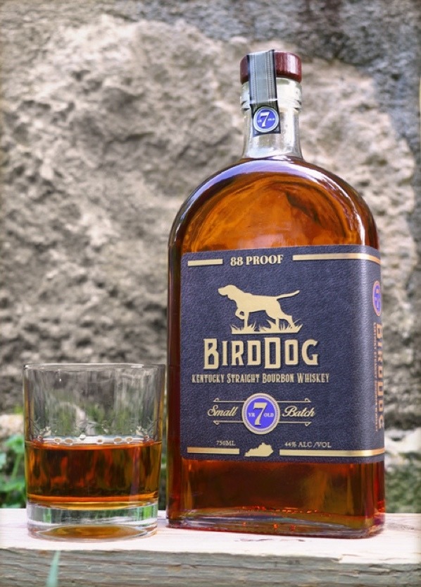 Bottle of Bird Dog 7 Year Old Small Batch with a Drink