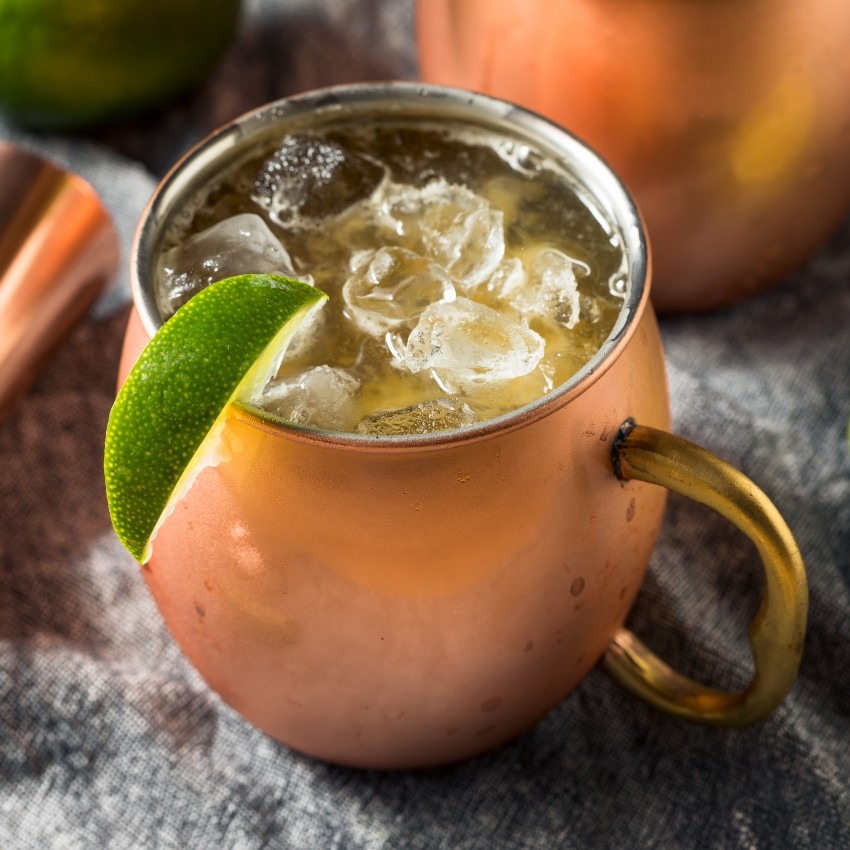 copper mug with ice and lime - containing Bird Dog's Mesquite Brown Sugar Kentucky Mule